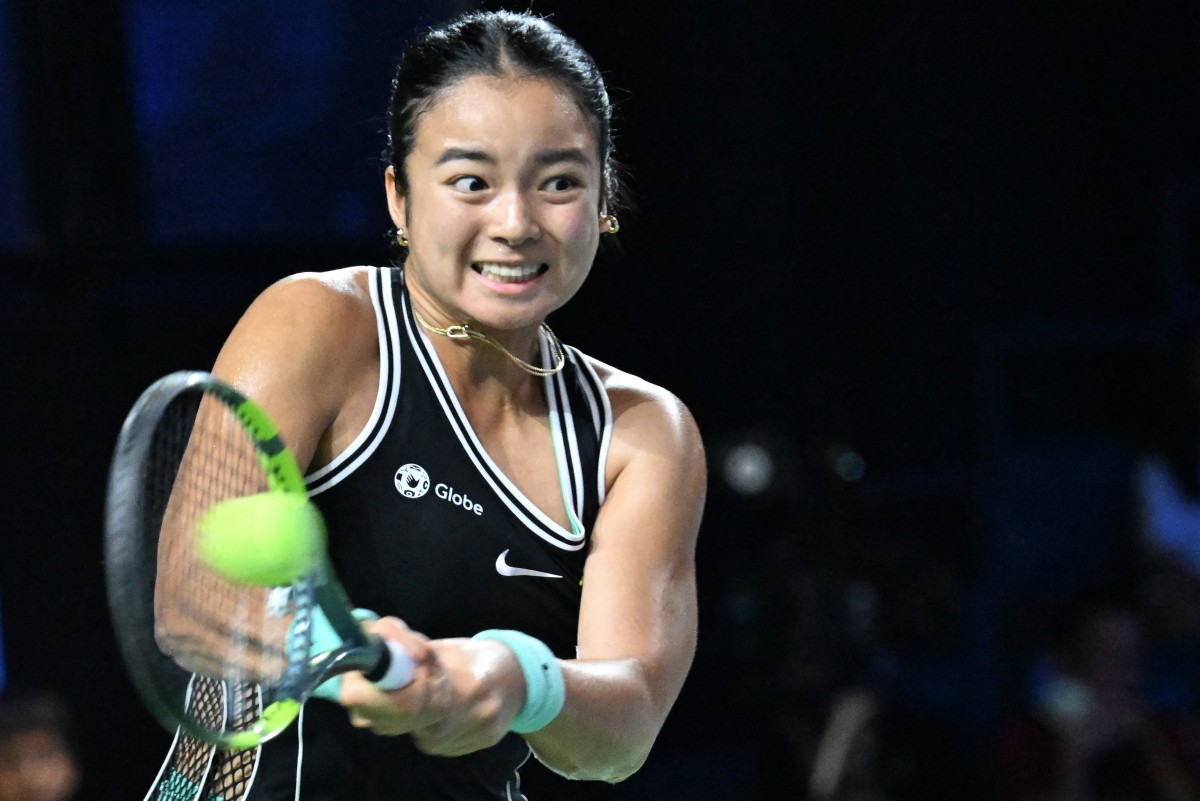 Philippines Alexandra Eala hits a return against Russia's Tatiana Prozorova during the WTA Singapore Open Tennis round 16 in Singapore on September 24, 2026. (Photo by Roslan Rahman / AFP)
