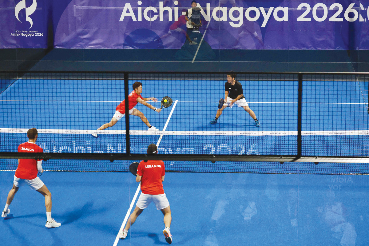 Japan’s Teruaki Ando and Shinnosuke Nakamura (top) play against Lebanon’s Tamim El Hallak and Ralph Tohme during the men’s pairs padel first round match at the Asian Games.