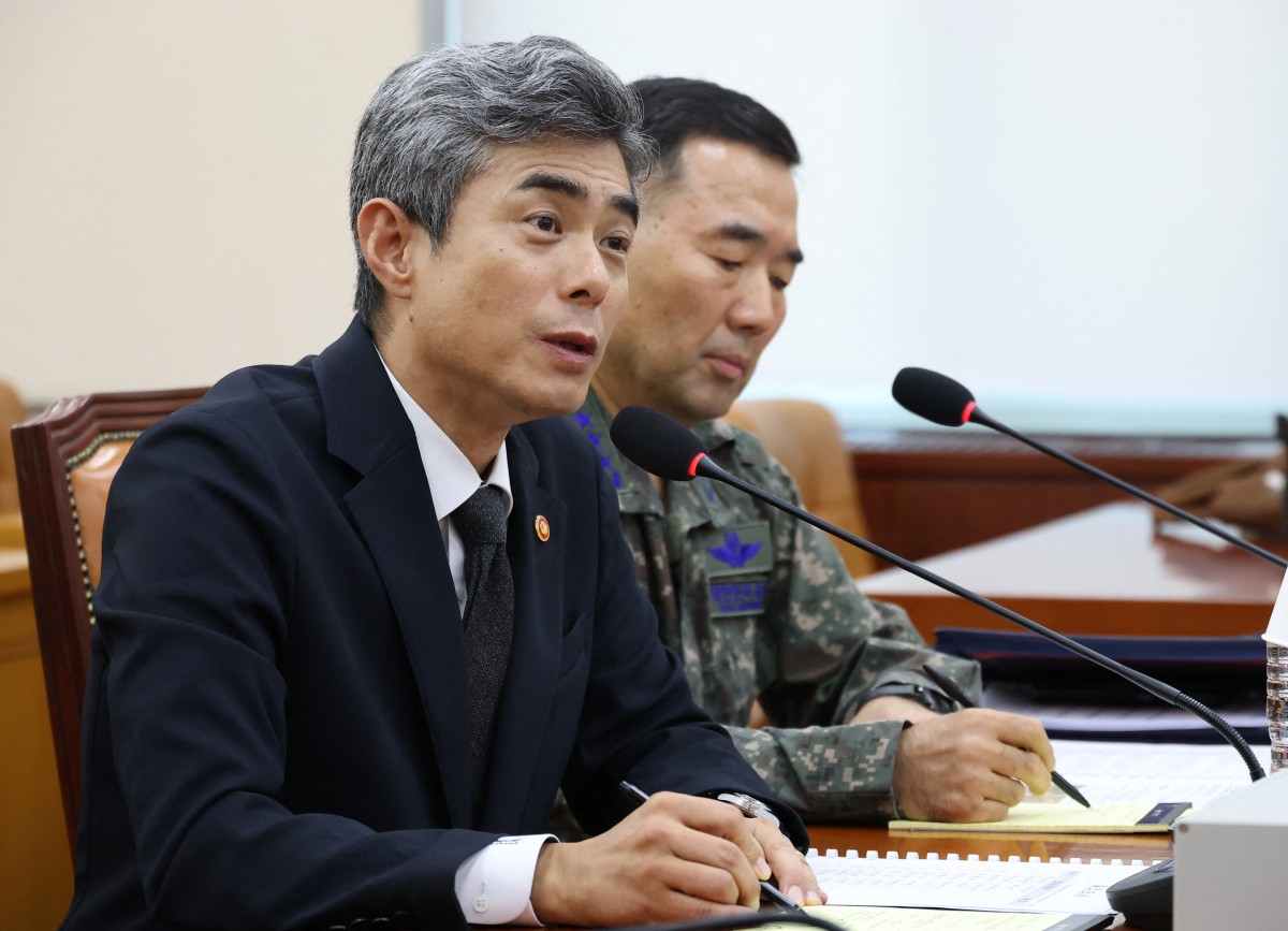 Defence Minister of the Republic of Korea Kang Shin-chul (L) speaks during a parliamentary defence committee hearing on the landmine explosion accident in the DMZ, at the National Assembly in Seoul on September 29, 2026. Photo by - / YONHAP / AFP