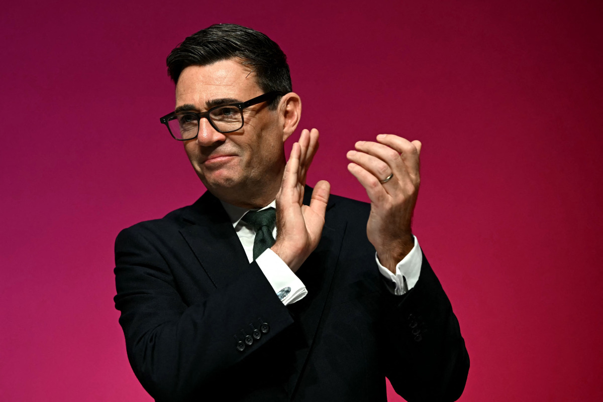 Britain's Prime Minister Andy Burnham applauds on the final day of the annual Labour Party conference in Liverpool, north-west England, on September 30, 2026. (Photo by Paul ELLIS / AFP)