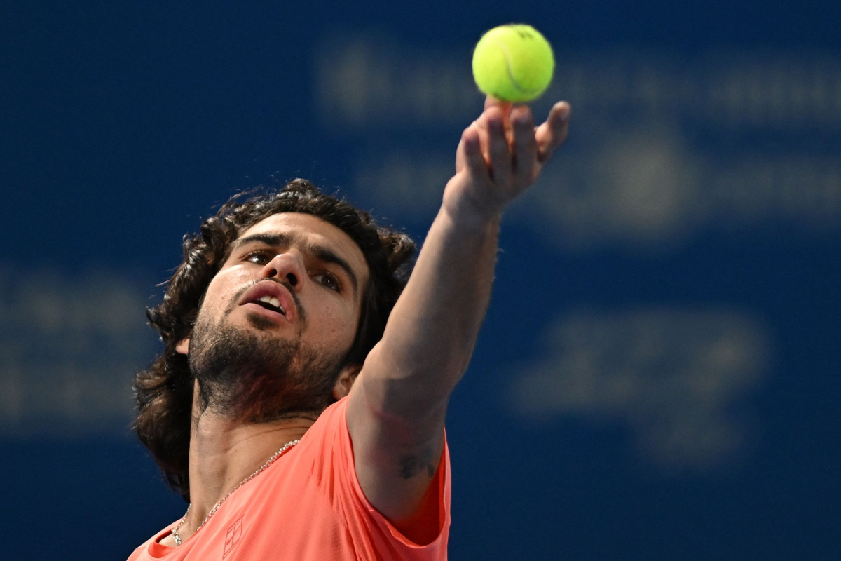 Spain's Carlos Alcaraz serves to compatriot Jaume Munar in their men's singles semi-final tennis match at the ATP Tour Japan Open Tennis Championships at the Ariake Tennis Forest Park in Tokyo on October 5, 2026. (Photo by Rie KIKUCHI / AFP)