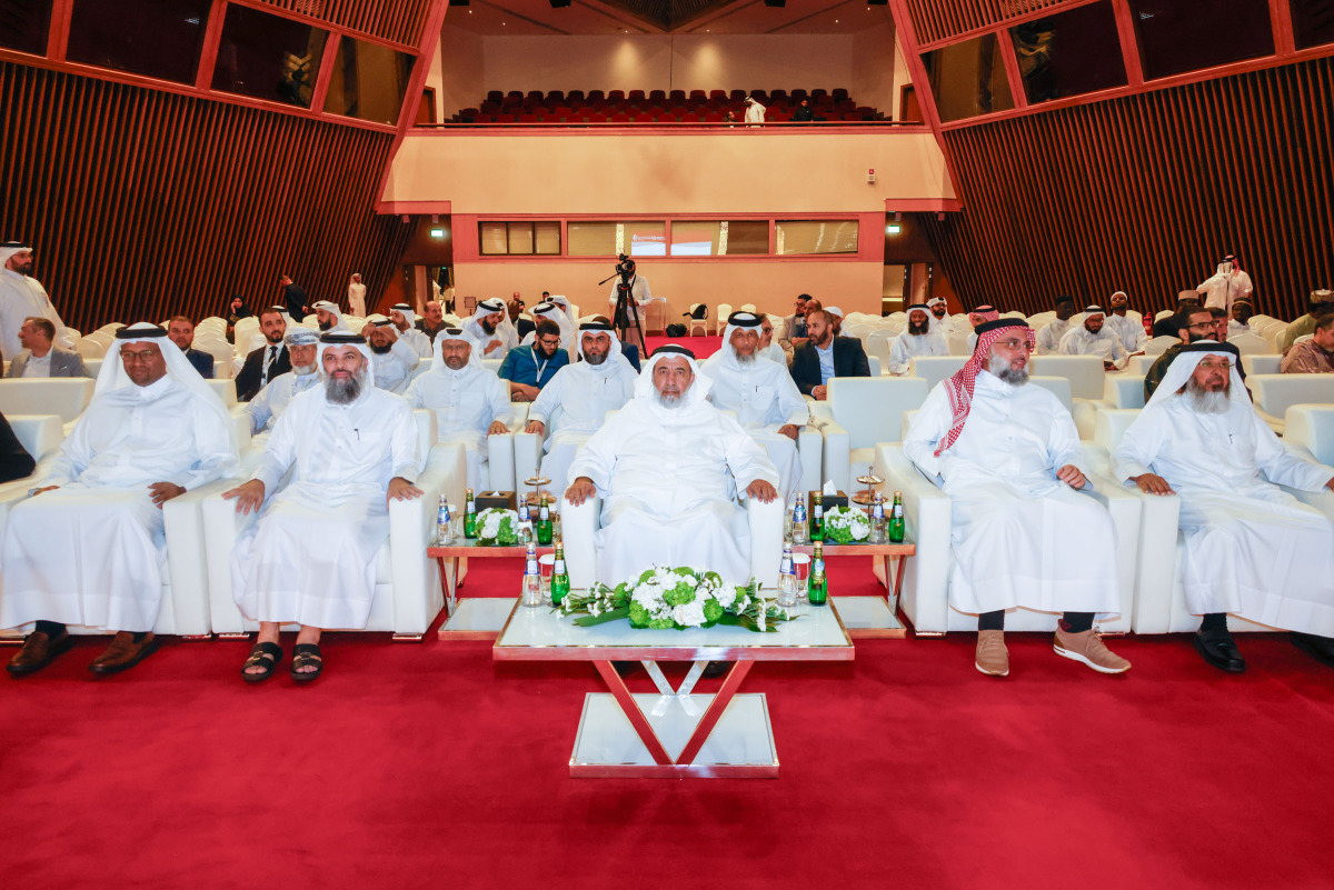 Minister of Awqaf and Islamic Affairs H E Ghanem bin Shaheen bin Ghanem Al Ghanim with other officials during an honouring ceremony.