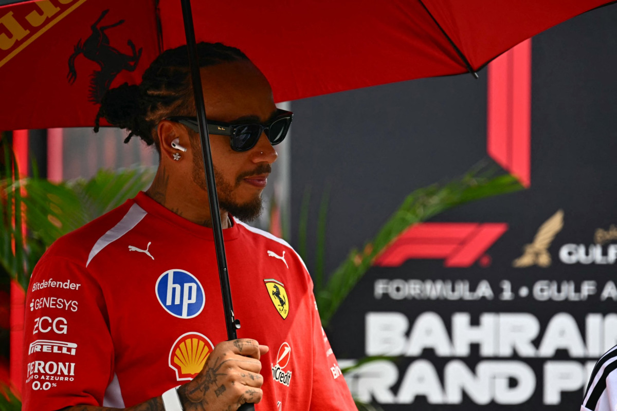 Ferrari's British driver Lewis Hamilton arrives ahead of the Formula One Bahrain Grand Prix in Sepang on October 4, 2026. (Photo by Lillian SUWANRUMPHA / AFP)
