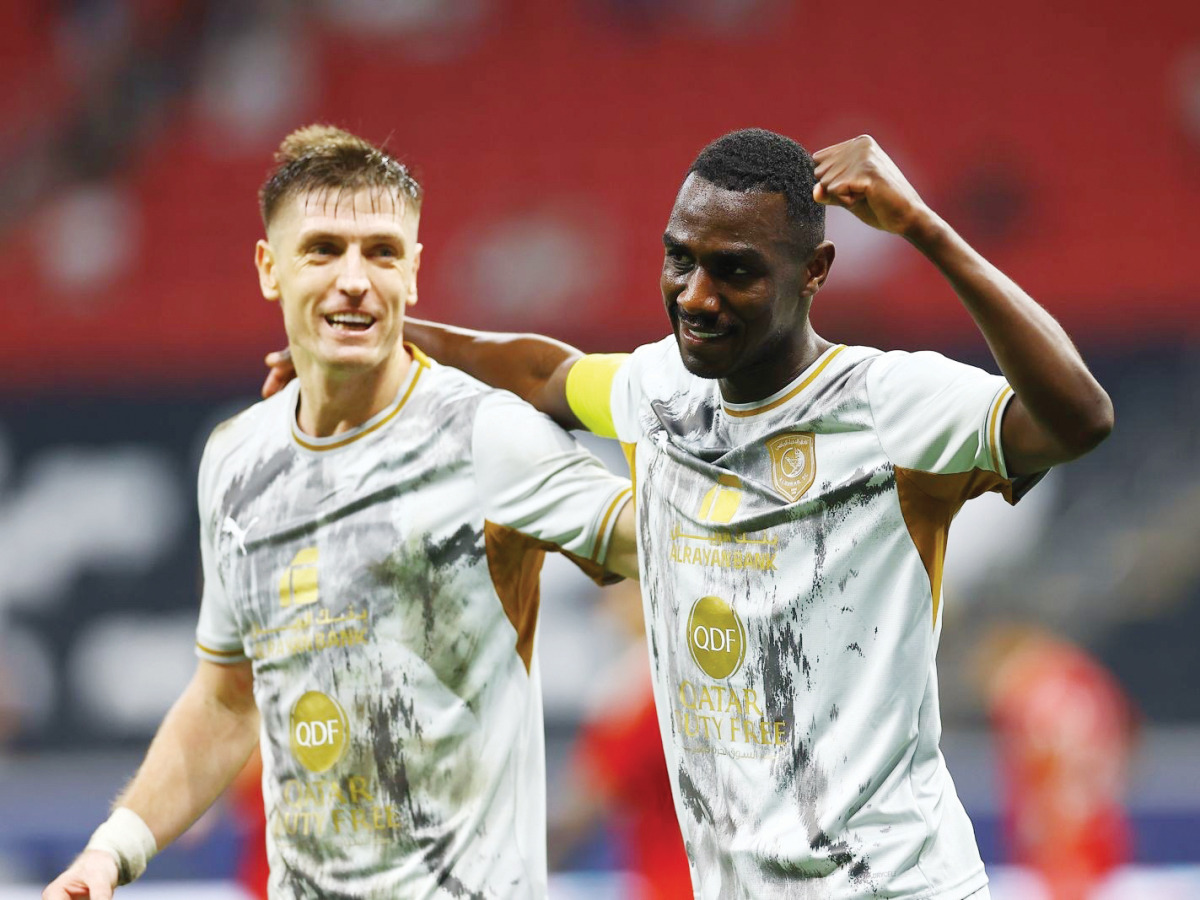 Al Duhail's Krzysztof Piatek (left) and Almoez Ali celebrate.