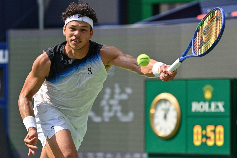 USA's Ben Shelton hits a return to France's Arthur Gea during their men's singles match at the Shanghai Masters tennis tournament in Shanghai on October 11, 2026. (Photo by Hector Retamal / AFP)
 