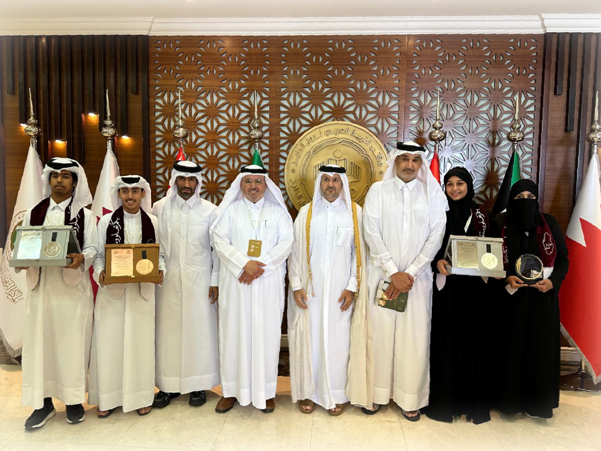 Officials with the winners of the literary competition.