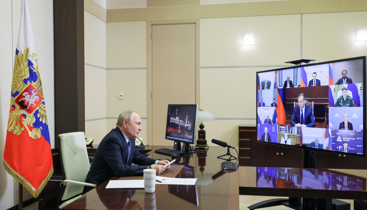 In this pool photograph distributed by the Russian state agency Sputnik, Russia's President Vladimir Putin chairs a meeting on cybersecurity with government and business members via videolink at the Novo-Ogaryovo residence outside Moscow on October 14, 2026. (Photo by Mikhail METZEL / POOL / AFP)
