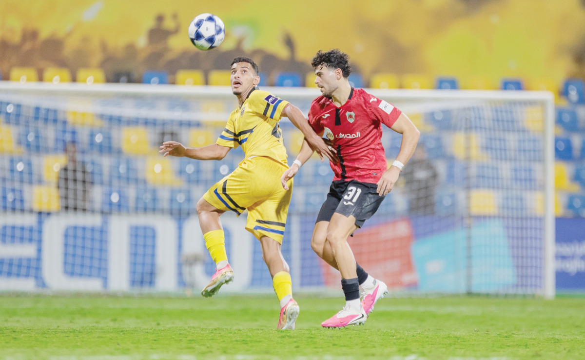 Action during the match between Al Rayyan and Al Taawoun.