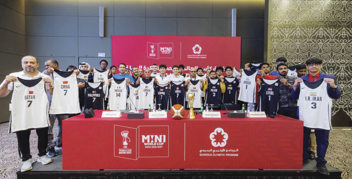 Representatives from the participating teams pose with their jerseys. 
