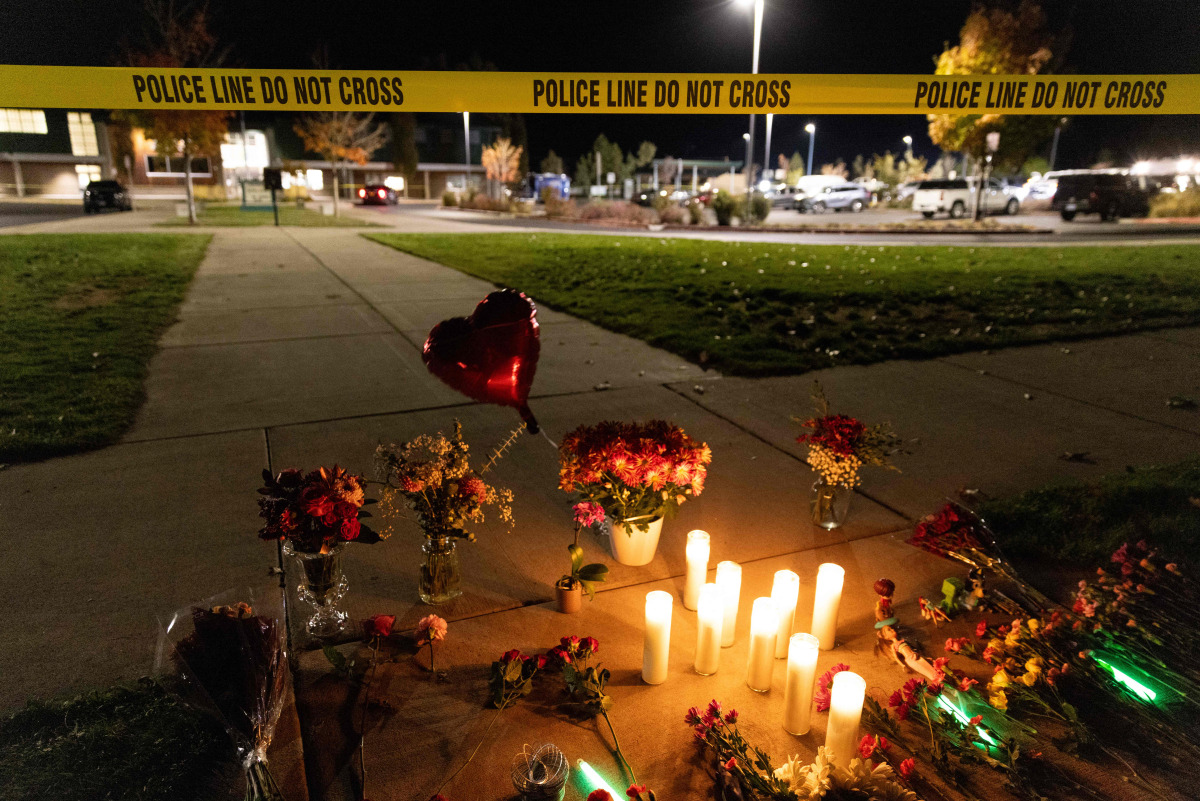 Candles and flowers are seen at a makeshift memorial outside the Silver Rail Elementary School following a shooting in Bend, Oregon, on October 15, 2026. Photo by Payton Bruni / AFP