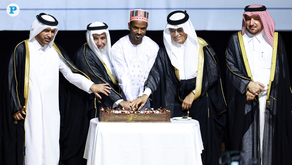 Minister of Endowments (Awqaf) and Islamic Affairs H E Ghanem bin Shaheen bin Ghanem Al Ghanim, with President of Qatar National Library and Minister of State H E Hamad Bin Abdulaziz Al-Kawari, Ambassador of the Republic of Guinea H E Thierno Abdoulaye Sow, General Manager of Katara Cultural Village H E Prof. Dr. Khaled Ibrahim Al-Sulaiti, Director of the Department of Protocol at MoFA H E Ambassador Ibrahim Yousif Abdullah Fakhro during the cake cutting ceremony. 
Pic: Rajan Vadakkemuriyil / The Peninsula
