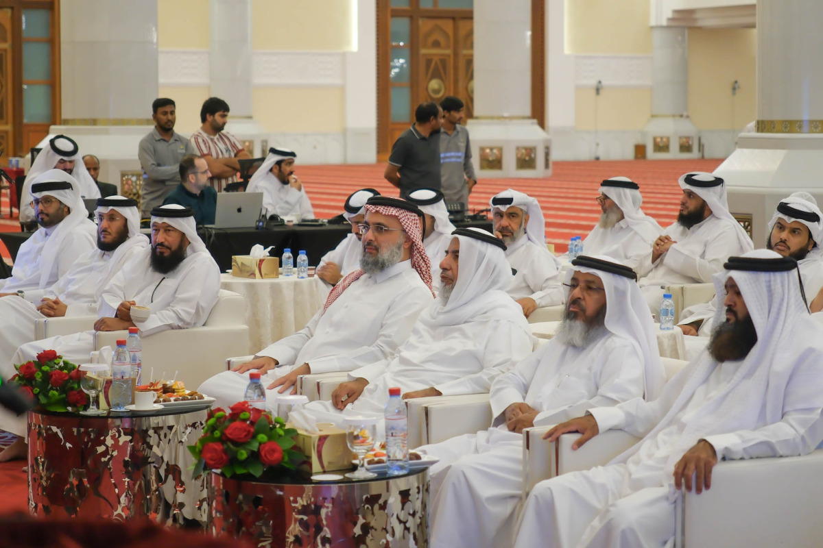 Minister of Awqaf and Islamic Affairs H E Ghanem bin Shahin bin Ghanem Al Ghanim with other officials during the event.