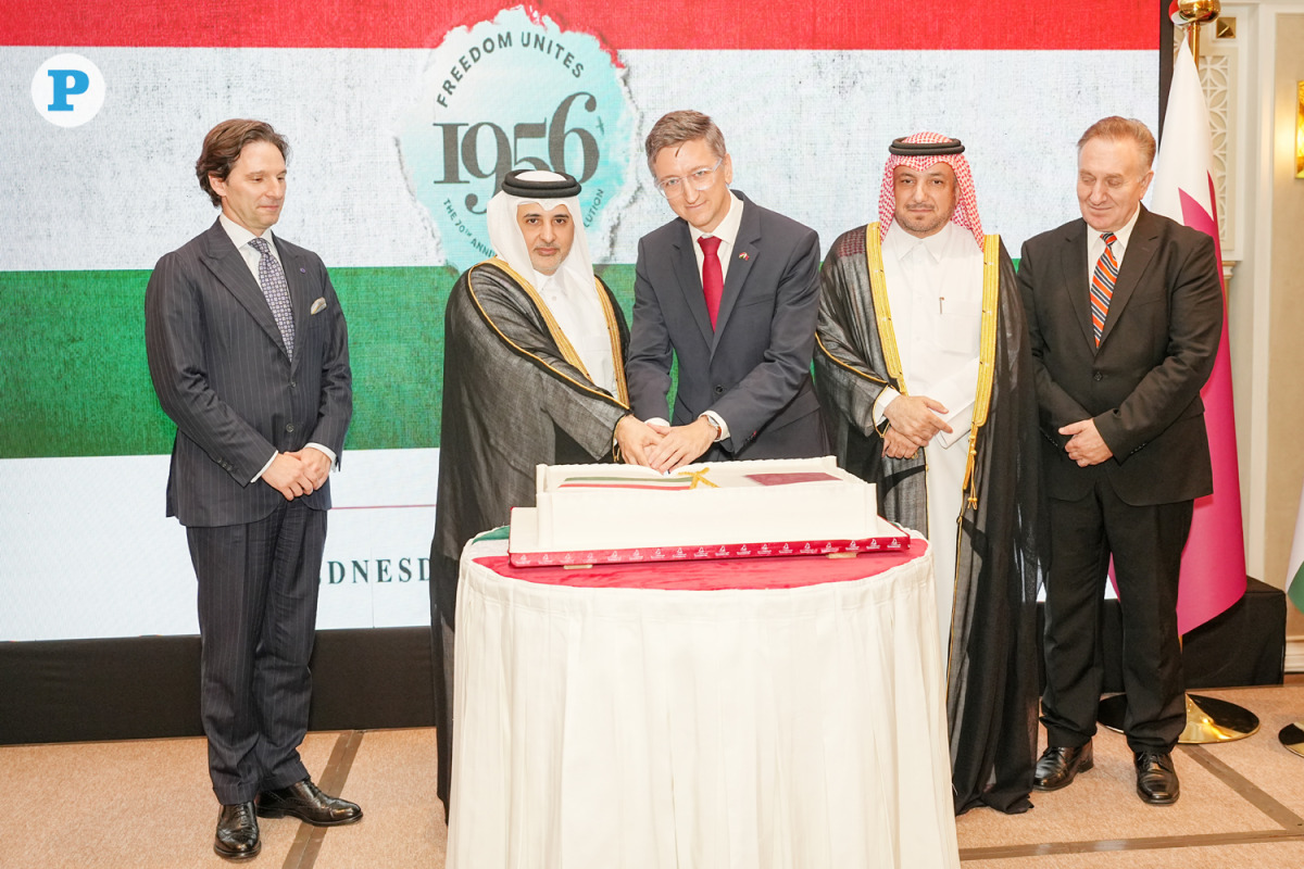 Minister of Environment and Climate Change H E Dr. Abdullah bin Abdulaziz bin Turki Al Subaie with Director of the Protocol Department at the Ministry of Foreign Affairs H E Ambassador Ibrahim Yousif Abdullah Fakhro and Chargé d’Affaires a.i. of the Embassy of Hungary Dávid Ambrus and other officials during the cake-cutting ceremony at the event yesterday.  PIC: Mohamed Elatar / The Peninsula