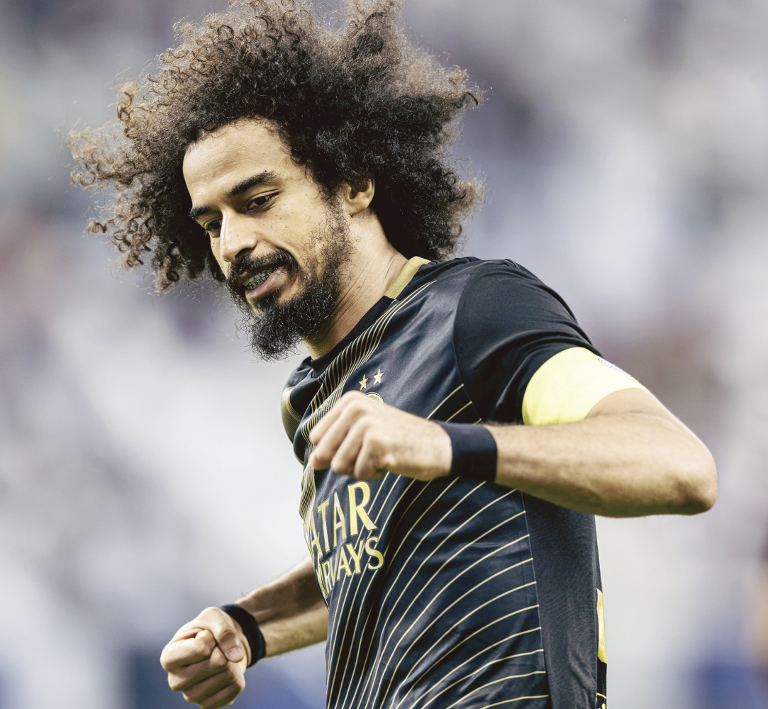 Al Sadd's Akram Afif celebrates after scoring a goal.