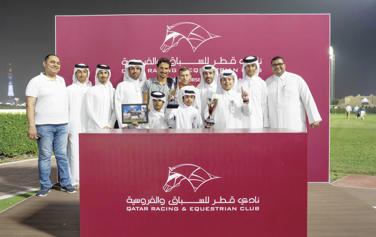 The connections of Weissmuller pose with the Sealine Cup, presented by Deputy Director of the QREC Registration and Studbook Department Saad Ali Al Kubaisi. BELOW: Szczepan Mazur steers Weissmuller to victory in the Sealine Cup. PICS: Juhaim/QREC
