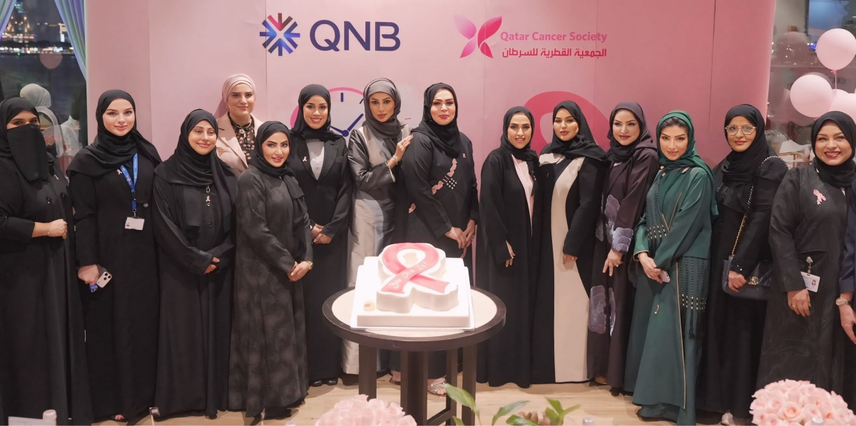 QNB Group and QCS officials at a breast cancer awareness event.