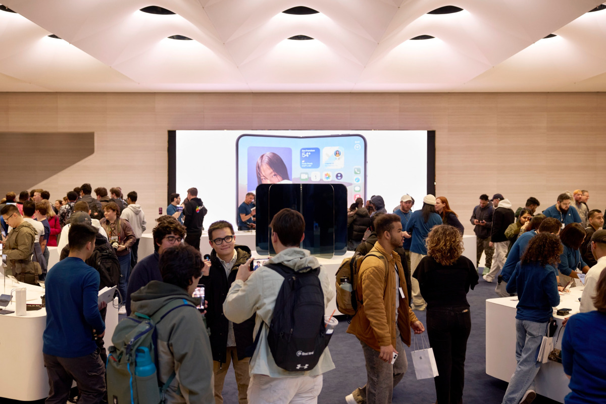 Customers being helped at an Apple store in NYC. Picture from Apple.com