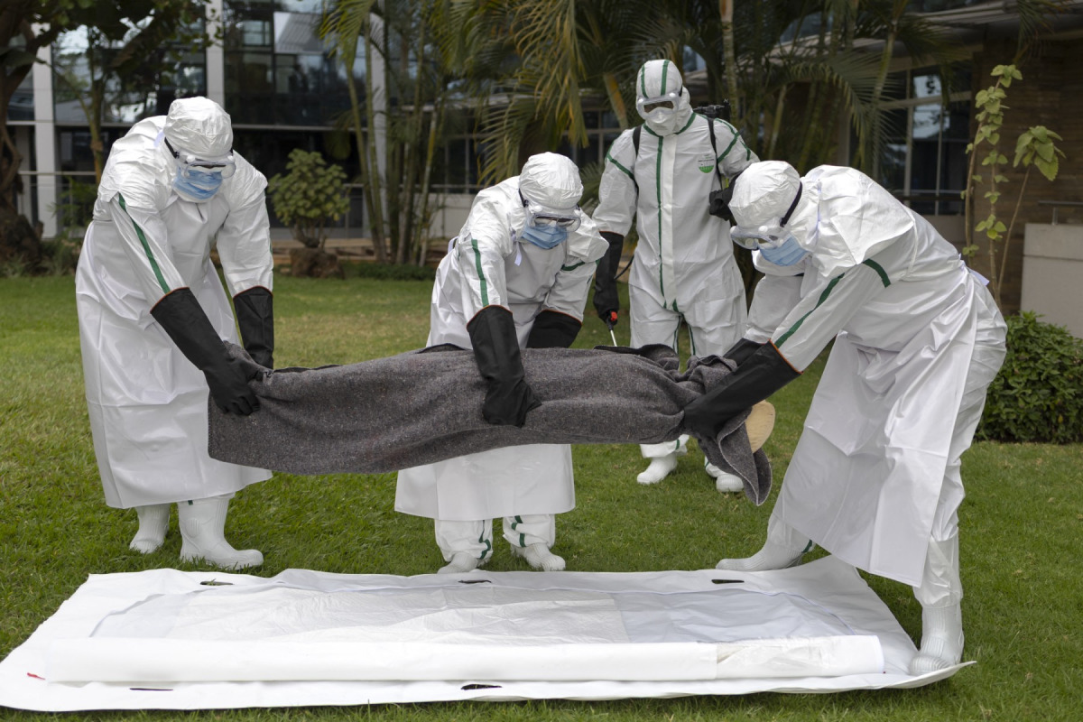 Kenya Red Cross personnel in Personal Protective Equipment (PPE) simulate the evacuation of remains of an Ebola victim in the Kenyan capital Nairobi on October 22, 2026. Photo by TONY KARUMBA / AFP