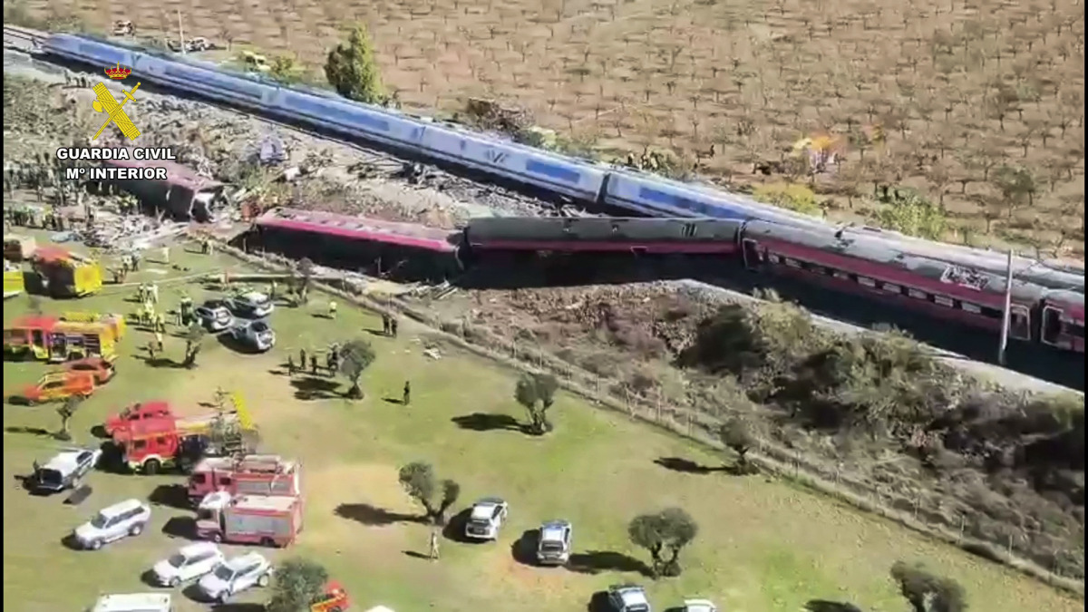 This still image from video taken and released by Spain's Civil Guard on October 28, 2026 shows an aerial scene of a train crash between a high speed Renfe AVE train and Iryo train around 150kms south of Madrid between Urda and Los Yebenes in the province of Toledo. (Photo by Handout / Guardia Civil / AFP)