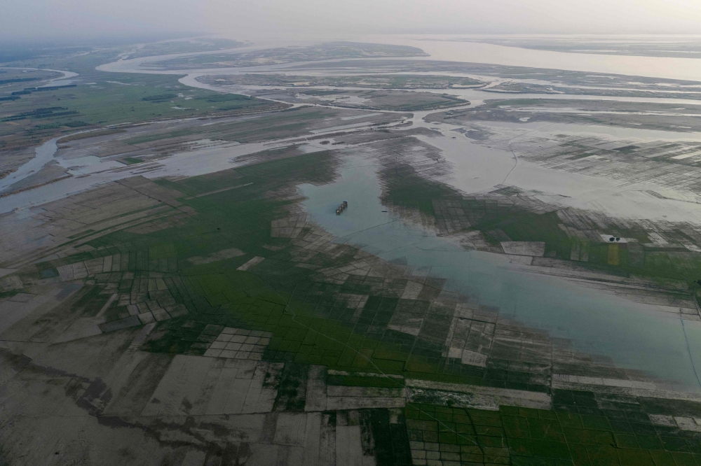 This aerial photograph taken on October 13, 2026, shows wetlands along the Padma river at Ujirpur, near the Bangladesh-India frontier in Bangladesh's Rajshahi division. (Photo by Salahuddin Ahmed / AFP)